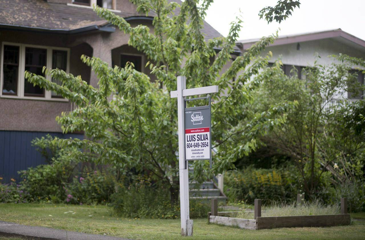 A real estate sign is pictured in Vancouver, B.C., Tuesday, June 12, 2018. A new report says Canada’s housing market is still firmly in correction mode, despite having slowed in recent months. THE CANADIAN PRESS Jonathan Hayward