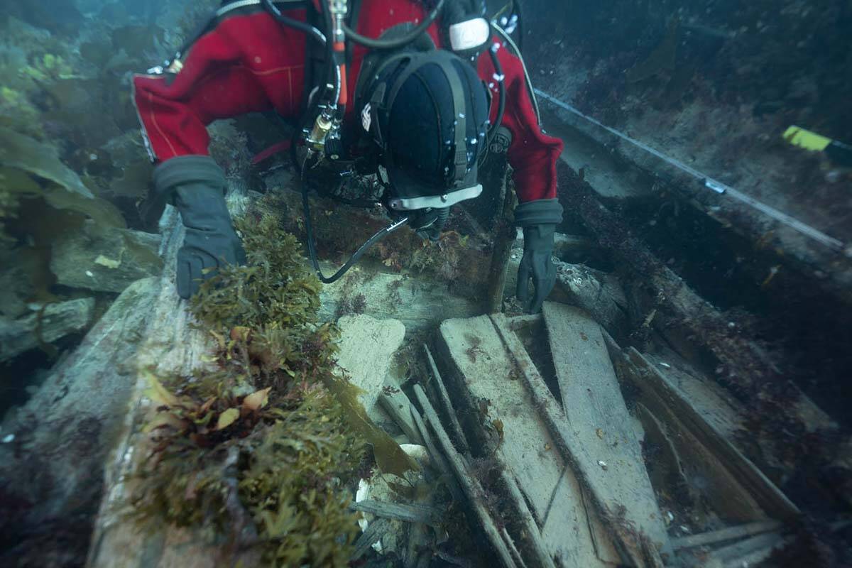 Parks Canada underwater archaeologist Jonathan Moore observes a washing basin and an officer’s bedplace on the lower deck of the wreck of the HMS Erebus during a dive in this September 2022 handout photo in the Northwest Passage. THE CANADIAN PRESS/HO, Parks Canada, Marc-Andre Bernier
