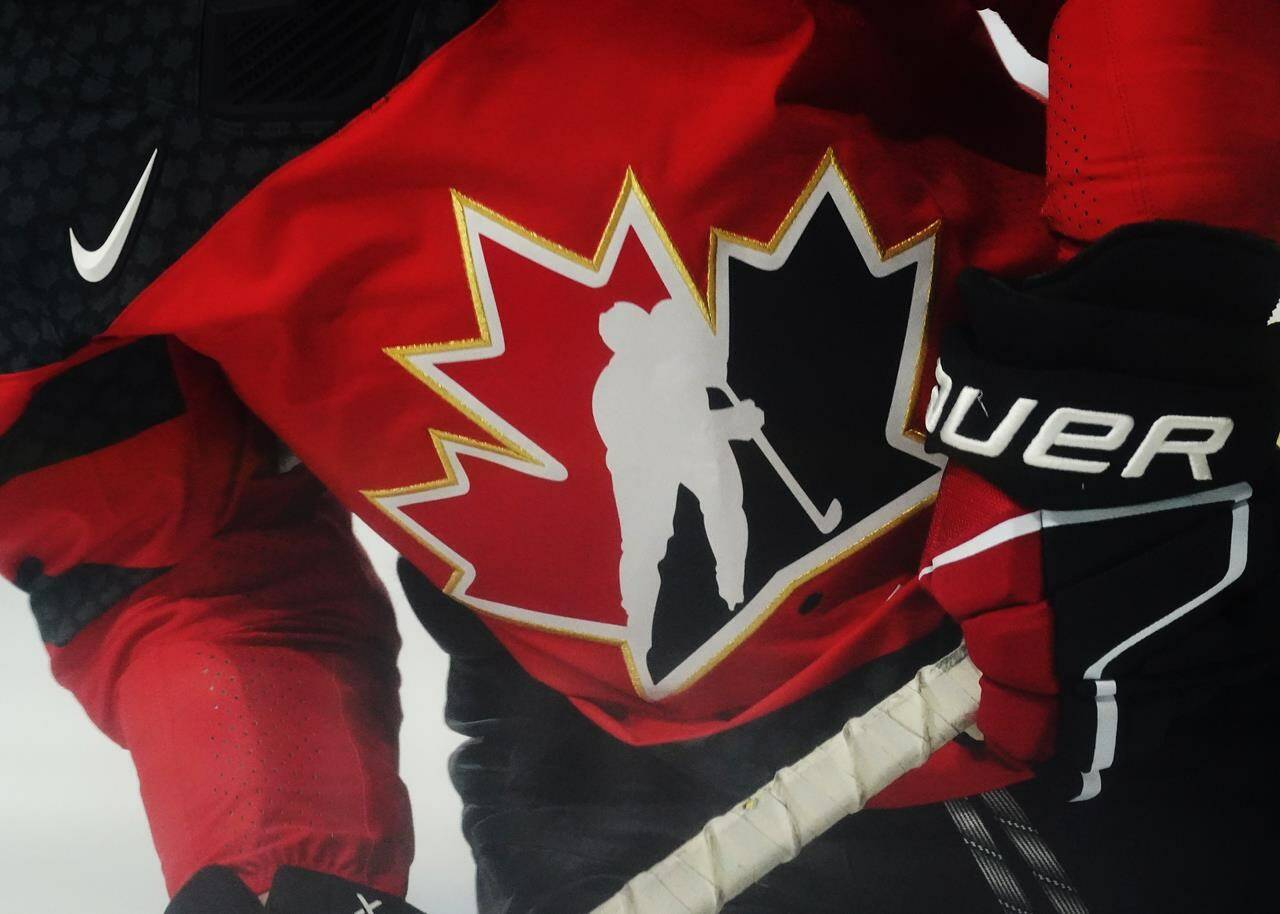 A Team Canada logo is shown on a player during warm-up. THE CANADIAN PRESS/Jesse Johnston