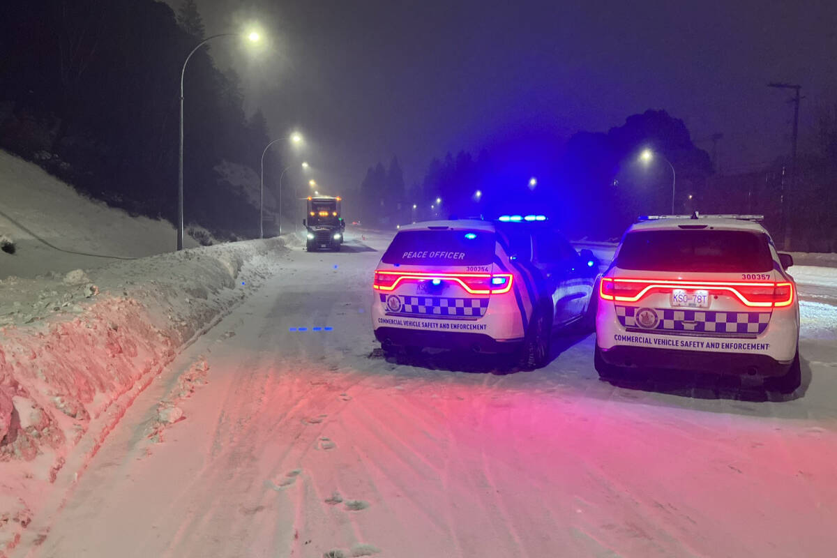 Commercial Vehicle Safety and Enforcement officers on the Malahat late Dec. 22 ensuring commercial vehicles are carrying chains and safety compliant. (BC Transportation/Twitter)