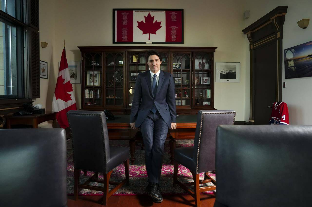 Prime Minister Justin Trudeau poses in his office in Ottawa on Monday, Dec. 12, 2022. Trudeau is asking Canadians to remind themselves how fortunate they are “to live in a country of peace.” THE CANADIAN PRESS/Sean Kilpatrick