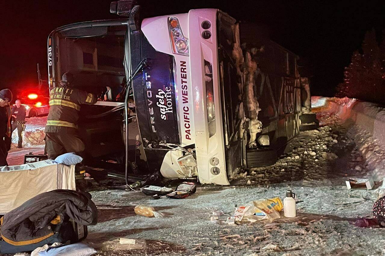 First responders look over the scene of a bus crash on Highway 97C Okanagan Connector between Merritt and Kelowna in this Saturday, Dec. 24, 2022 handout photo. THE CANADIAN PRESS/HO, Bill Gerber