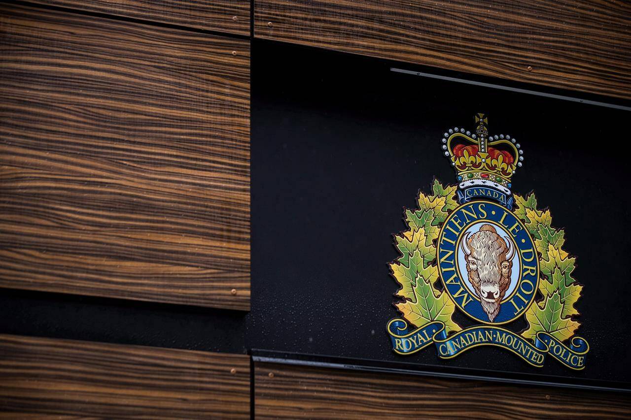 The RCMP logo is seen outside Royal Canadian Mounted Police “E” Division Headquarters, in Surrey, B.C., on April 13, 2018. THE CANADIAN PRESS/Darryl Dyck