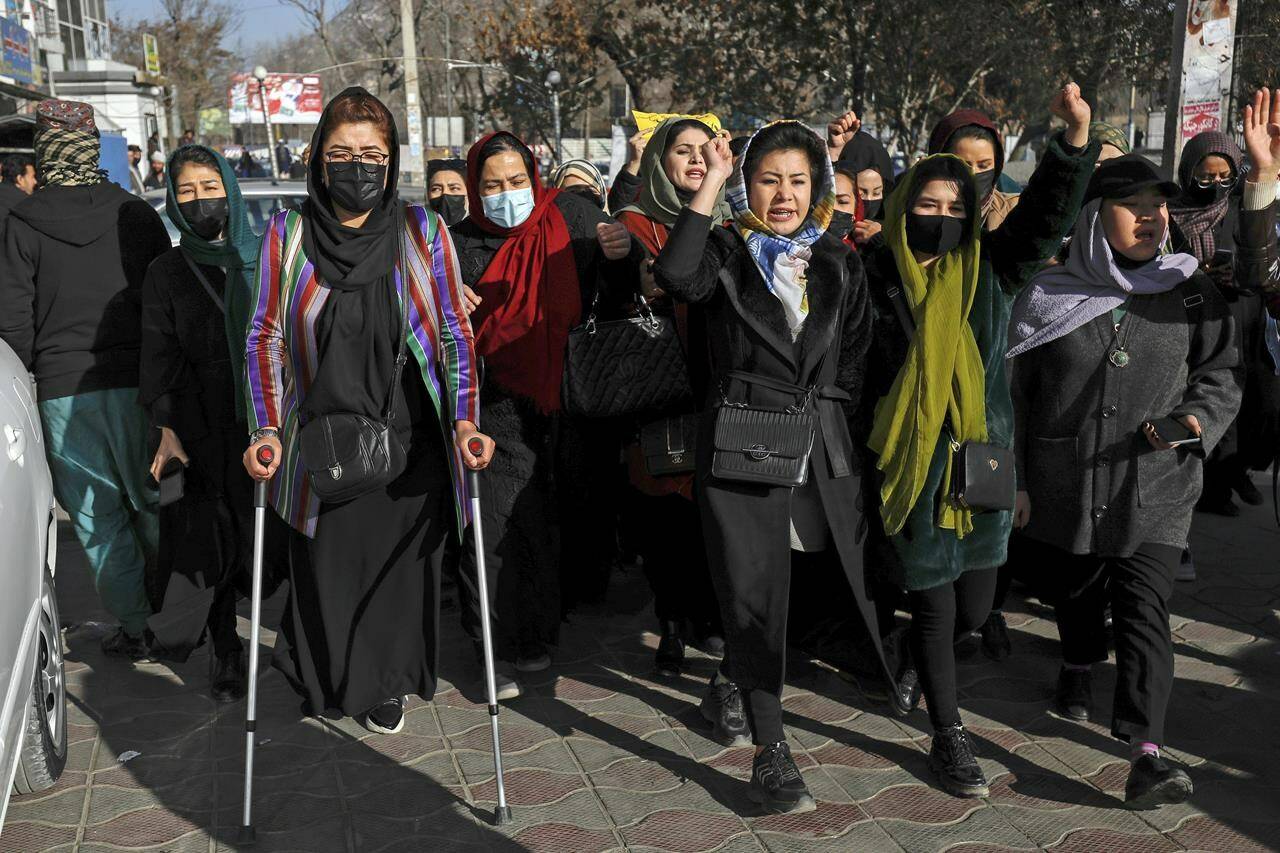 Afghan women chant slogans during a protest against the ban on university education for women, in Kabul, Afghanistan, Thursday, Dec. 22, 2022. Canada’s international development minister is calling on the Taliban to reverse its decision to bar women in Afghanistan from working at non-governmental organizations (NGOs.) THE CANADIAN PRESS/AP