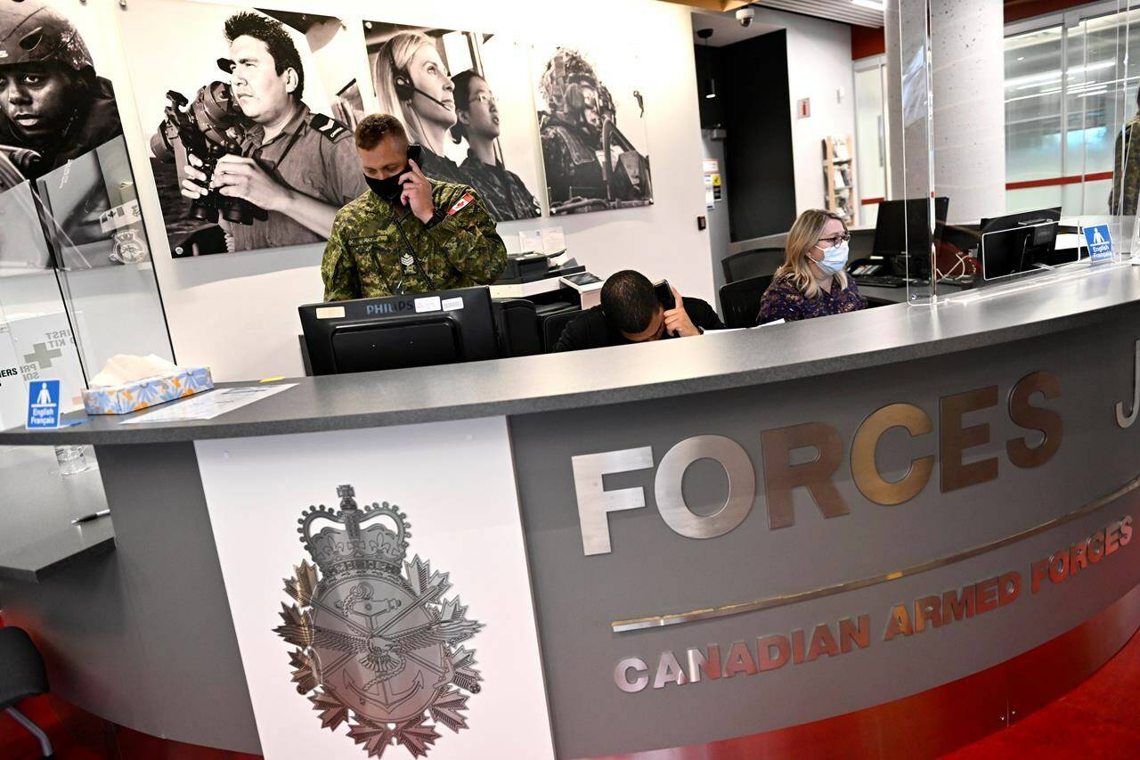 Staff work at a Canadian Armed Forces recruitment centre in Ottawa, on Tuesday, Sept. 20, 2022. The Canadian Armed Forces says it has received more than 2,400 applications from permanent residents interested in joining the military since the beginning of November. THE CANADIAN PRESS/Justin Tang