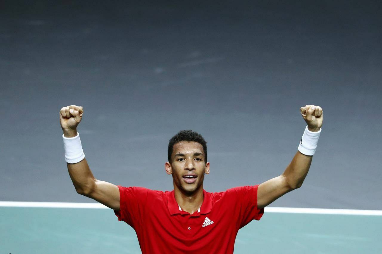 Canada’s Felix Auger Aliassime celebrates after defeating Australia’s Alex de Minaur during the final Davis Cup tennis match between Australia and Canada in Malaga, Spain, Sunday, Nov. 27, 2022. Auger-Aliassime is being rewarded for his breakthrough season by winning the Lionel Conacher Award as The Canadian Press male athlete of the year. THE CANADIAN PRESS/AP/Joan Monfort