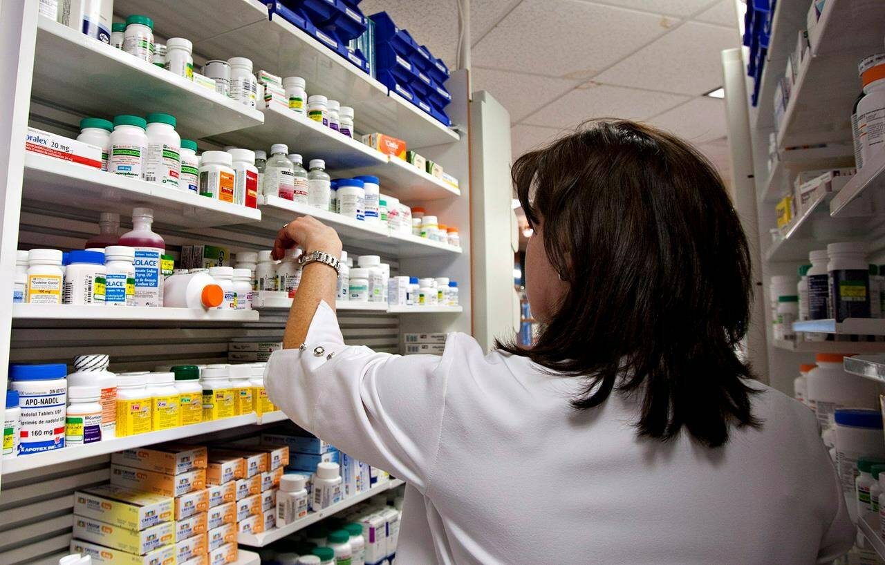 A lab technician prepares a prescription at a pharmacy in Quebec City, Thursday, March 8, 2012. In a year when pharmacists have stickhandled children’s drug shortages and an extra-busy flu shot season, you’d think they might balk at the news in Ontario and B.C. that their prescriptive powers are being expanded. Yet those in the field say the added responsibilities may make their jobs more fulfilling — so long as the changes are accompanied with appropriate funding. THE CANADIAN PRESS/Jacques Boissinot