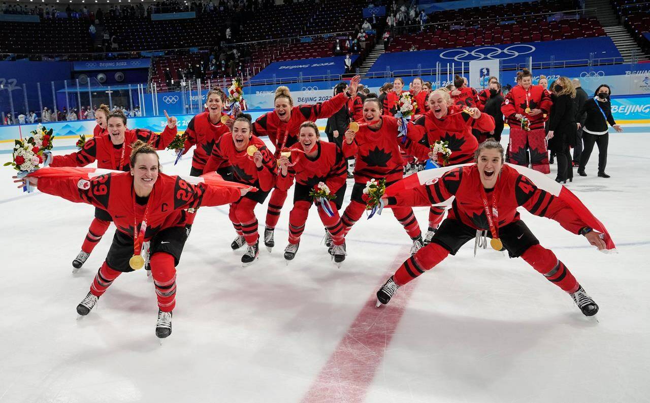 Team Canada players celebrate with their gold medals after defeating the United States in women’s hockey gold medal game action at the 2022 Winter Olympics in Beijing on Thursday, Feb. 17, 2022. Women’s hockey in 2022 was a firehose filled with change and advancement after the virtual desert of the COVID-19 pandemic. THE CANADIAN PRESS/Ryan Remiorz