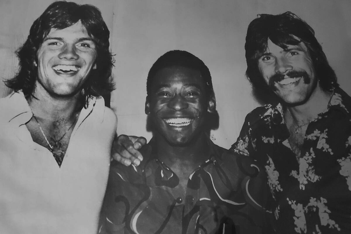 Bob Lenarduzzi, left, and Sam Lenarduzzi, right, with the legendary Pele. (Submitted photo)