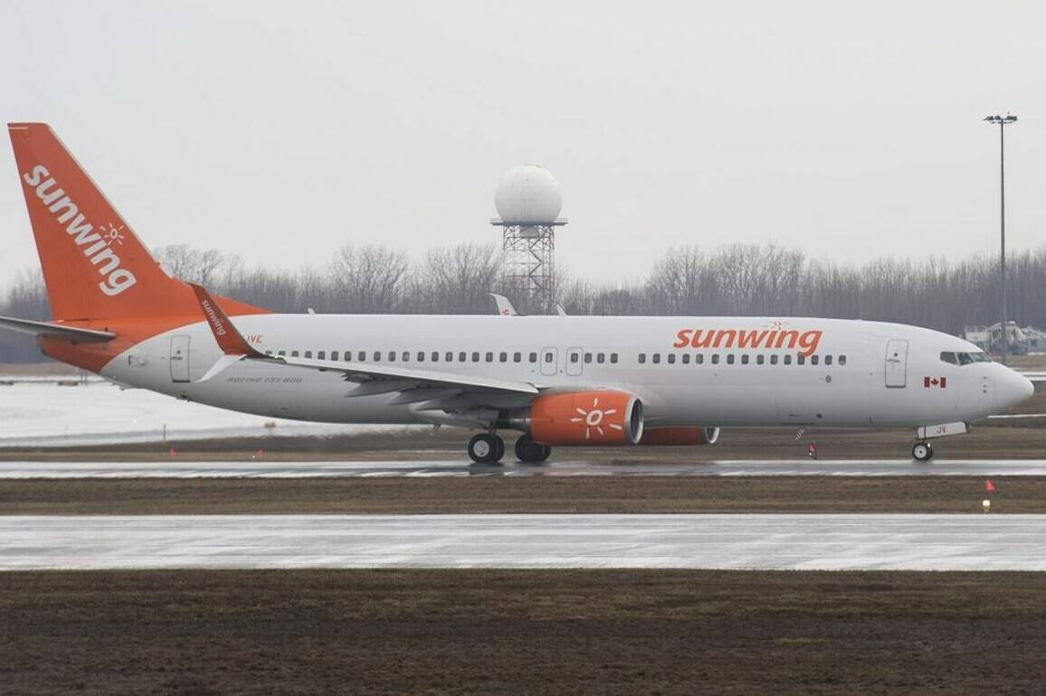 A Sunwing Airlines jet prepares to takeoff at Trudeau International Airport in Montreal on Friday, March 20, 2020. Some Sunwing travellers from Saskatchewan say the airline is leaving them at airports in other provinces, while another says her flight from Mexico that made it to Regina had dozens of empty seats. THE CANADIAN PRESS/Graham Hughes