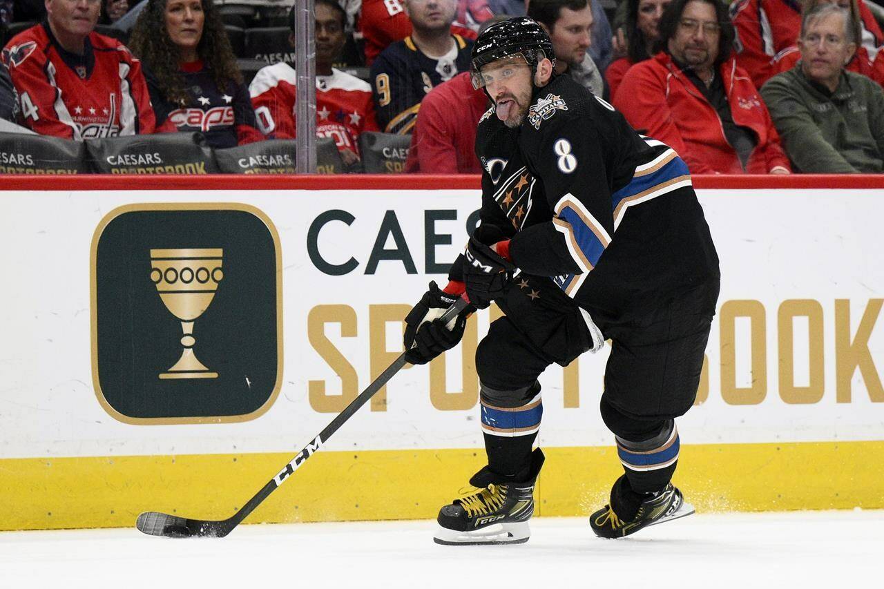 Washington Capitals left wing Alex Ovechkin skates with the puck during the second period of the team’s NHL hockey game against the Buffalo Sabres, Tuesday, Jan. 3, 2023, in Washington. (AP Photo/Nick Wass)