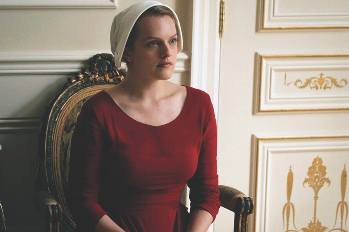 Elisabeth Moss is shown in a scene from The Handmaid’s Tale. The television series is based on the novel by Canadian author Margaret Atwood. What futuristic technology is used in this novel? (George Kraychyk/Hulu via AP)