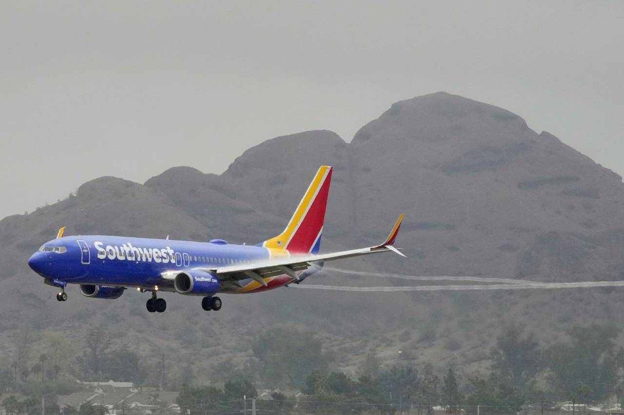 A Southwest Airlines jet arrives at Sky Harbor International Airport, Wednesday, Dec. 28, 2022, in Phoenix. Travelers who counted on Southwest Airlines to get them home suffered another wave of canceled flights Wednesday, and pressure grew on the federal government to help customers get reimbursed for unexpected expenses they incurred because of the airline’s meltdown. (AP Photo/Matt York)