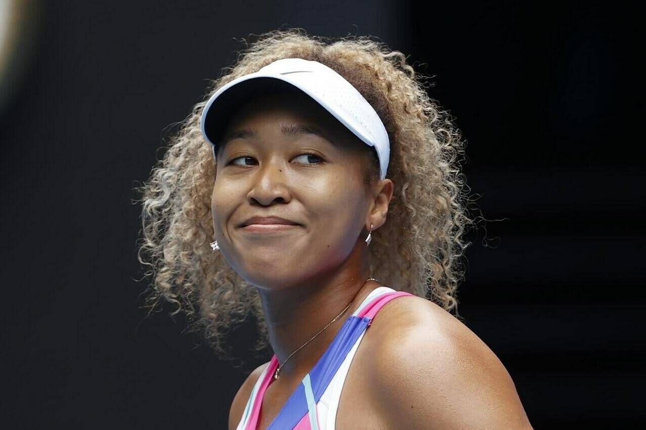 FILE - Naomi Osaka of Japan smiles during her first round match against Camila Osorio of Colombia at the Australian Open tennis championships in Melbourne, Australia, Monday, Jan. 17, 2022. Naomi Osaka is pregnant and plans to return to competition in 2024, the tennis star announced Wednesday, Jan. 11, 2023. The former world No. 1 posted a life update Wednesday on social media, including a picture of an ultrasound. (AP Photo/Simon Baker, File)