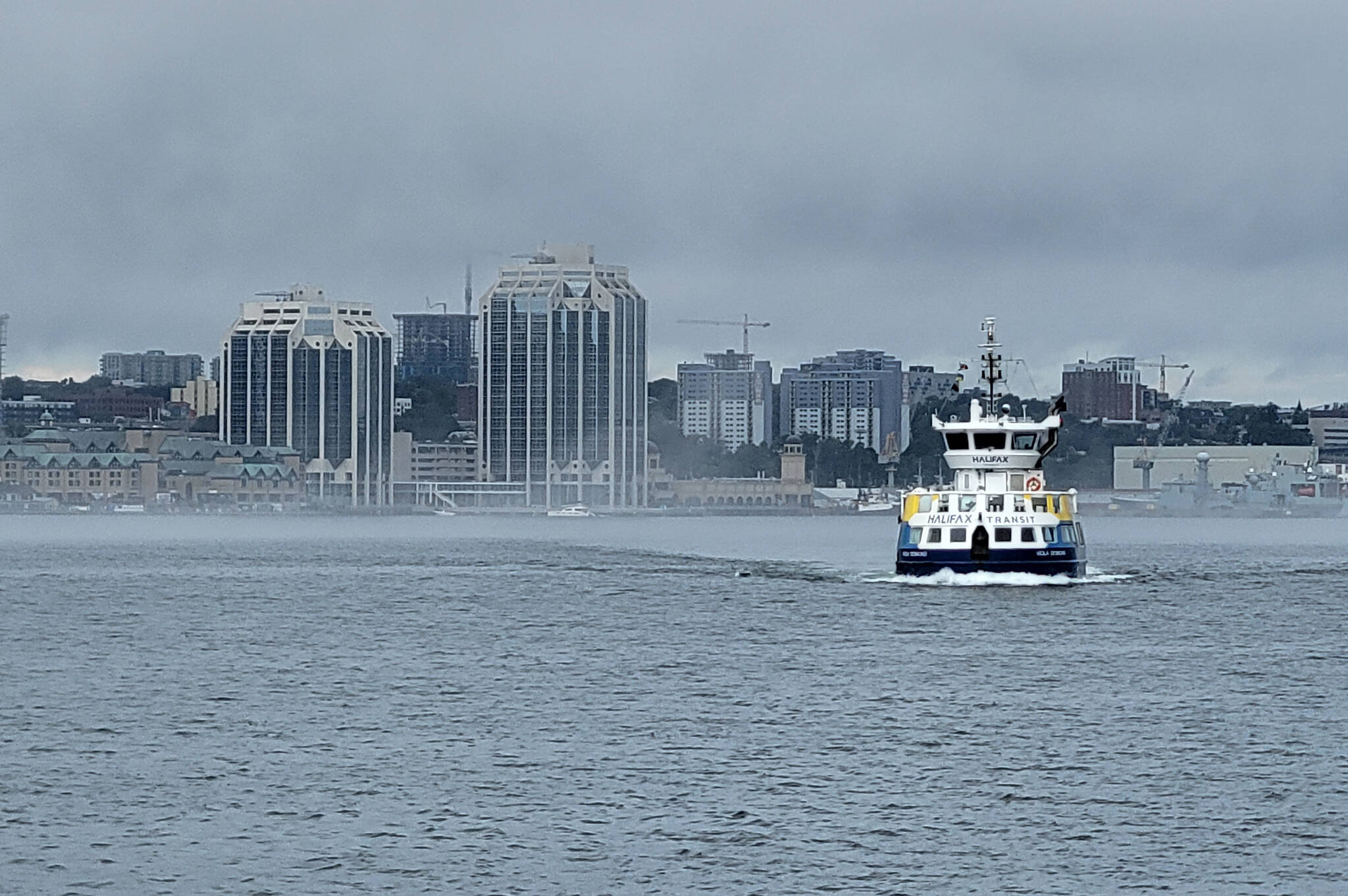 A passenger ferry, operated by Halifax Transit, makes its way across the Halifax harbour to the Woodside ferry terminal in Dartmouth, N.S., on Tuesday, Aug. 2, 2022. Statistics Canada says that Moncton, N.B., and Halifax were the fastest-growing urban regions in Canada in the past year. THE CANADIAN PRESS/Doug Ives