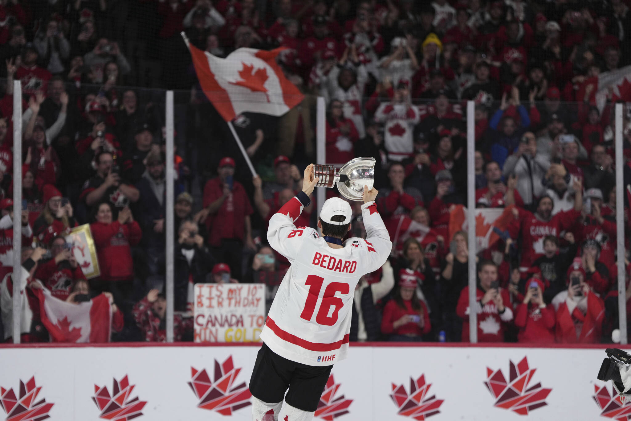 Canada’s Connor Bedard carries the Championship Cup after the team’s overtime win against Czechia in the title game of the IIHF world junior hockey championships Thursday, Jan. 5, 2023, in Halifax, Nova Scotia. (Darren Calabrese/The Canadian Press via AP)