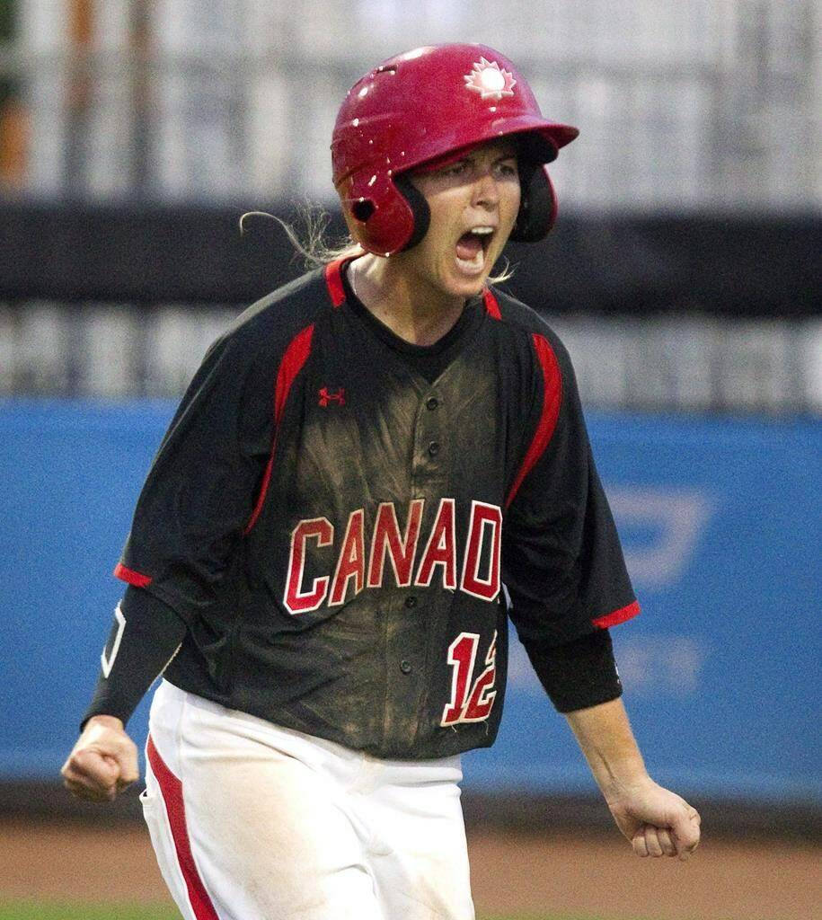 Canada’s Ashley Stephenson reacts after scoring during fifth inning women’s baseball action against Venezuela at the Pan American Games in Toronto on Saturday July 25, 2015. Stephenson, a long-time player and coach with Canada’s women’s baseball team, is joining the Toronto Blue Jays’ organization as a coach with the Vancouver Canadians. THE CANADIAN PRESS/Fred Thornhill