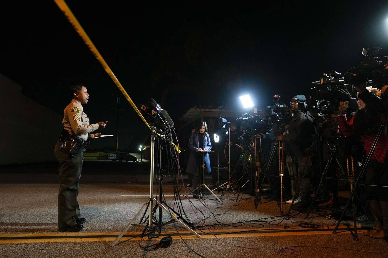 Members of the media wait for a briefing in Monterey Park, Calif., Sunday, Jan. 22, 2023. Nine people were killed in a mass shooting late Saturday in a city east of Los Angeles following a Lunar New Year celebration that attracted thousands, police said. (AP Photo/Jae C. Hong)