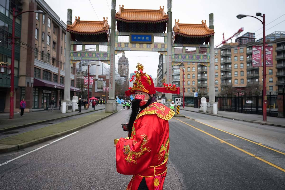 Terry Liu, dressed as the God of Wealth, prepares for the Lunar New Year parade in Chinatown, in Vancouver, on Sunday, January 22, 2023. THE CANADIAN PRESS/Darryl Dyck