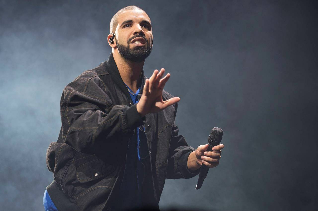 FILE - In this Oct. 8, 2016 file photo, Drake performs onstage in Toronto on Oct. 8, 2016. (Photo by Arthur Mola/Invision/AP, File)