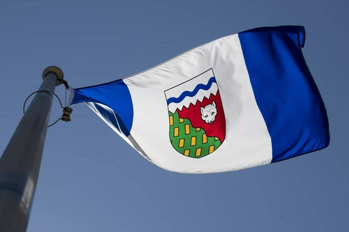 The Northwest Territories is considering whether to end seasonal time changes after a survey suggested there’s interest in the move. The Northwest Territories flag flies on a flag pole in Ottawa, Monday July 6, 2020. THE CANADIAN PRESS/Adrian Wyld