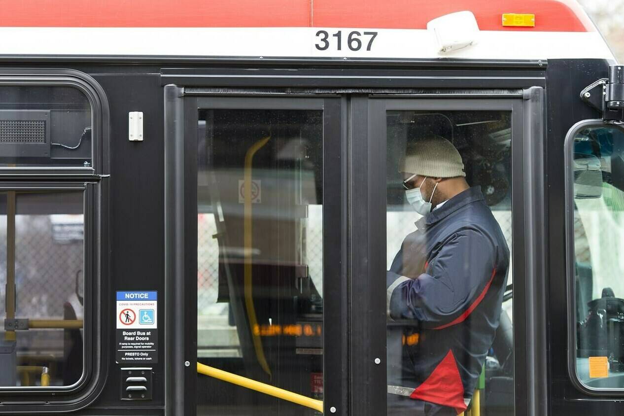 A TTC worker is shown in a bus while on shift in Toronto on April 23, 2020. Police continue to investigate after up to 15 youth allegedly attacked two Toronto Transit Commission workers on a bus. Toronto police say officers responded to the area of Kennedy Road and Merrian Road in the city’s east end Monday afternoon where a group of 10 to 15 youths, all male, allegedly assaulted two TTC employees.THE CANADIAN PRESS/Nathan Denette