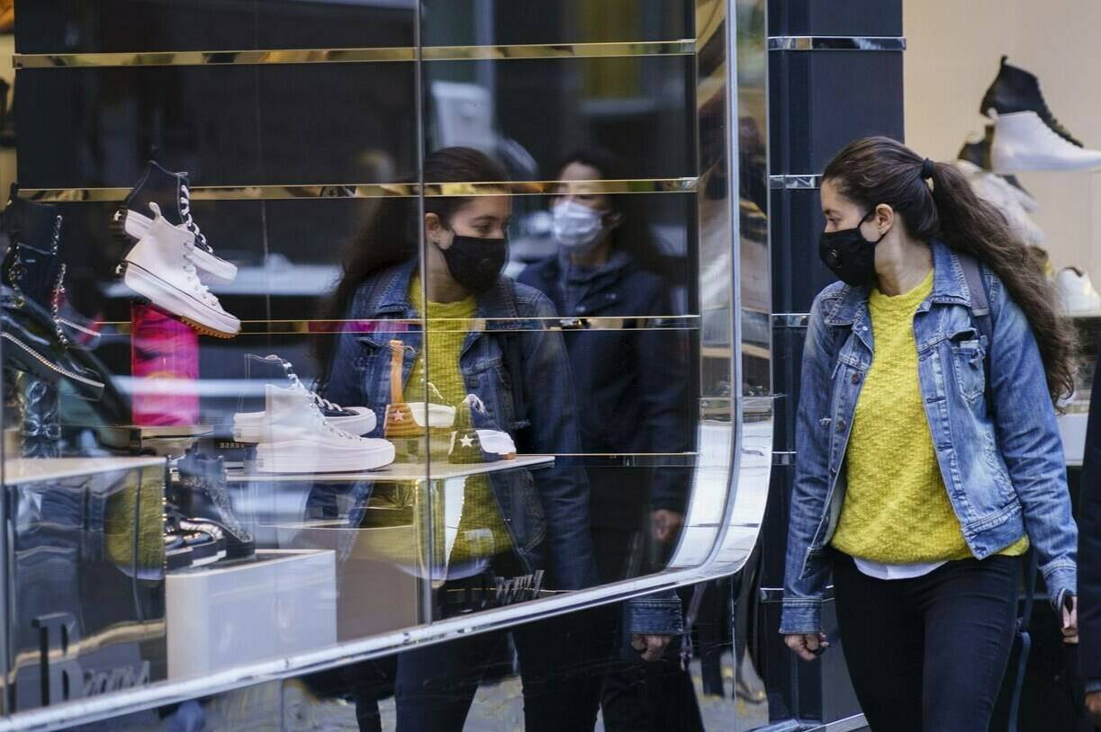 As inflation continues to weigh on Canadians’ budgets, some may have entered the new year taking on a self-imposed “no-buy challenge.” A woman does a bit of window shopping along Montreal’s Sainte-Catherine Street, on Tuesday, October 20, 2020. THE CANADIAN PRESS/Paul Chiasson