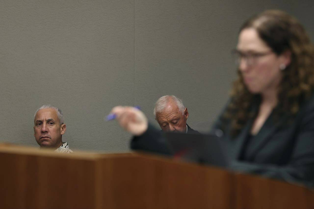 Albert “Ian” Schweitzer, left, looks on as Innocence Project attorney Susan Freidman speaks during Schweitzer’s court case Tuesday, Jan. 24, 2023, in Hilo, Hawaii. Attorneys for Schweitzer, imprisoned for more than 20 years after his conviction for the 1991 sexual assault, kidnapping, and murder of a white woman visiting the Big Island, ask a judge Tuesday to dismiss his conviction due to new evidence, including DNA testing in the case. (Marco Garcia/The Innocence Project via AP Images)