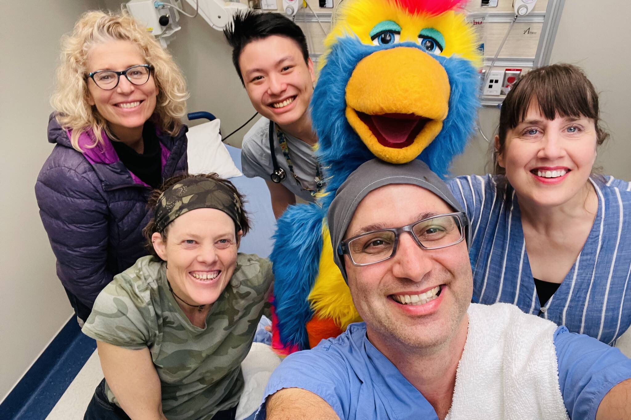 Peace Arch Hospital doctor Amir Behboudi, front, with puppeteer and ventriloquist Kellie Haines, Magrau and UBC medical student Tsz Shing (Brandon) Ng pose with Beyond Your Eye Productions’ Carmen Klotz left, and Sharron Bates during a video filming session. (contributed photo)