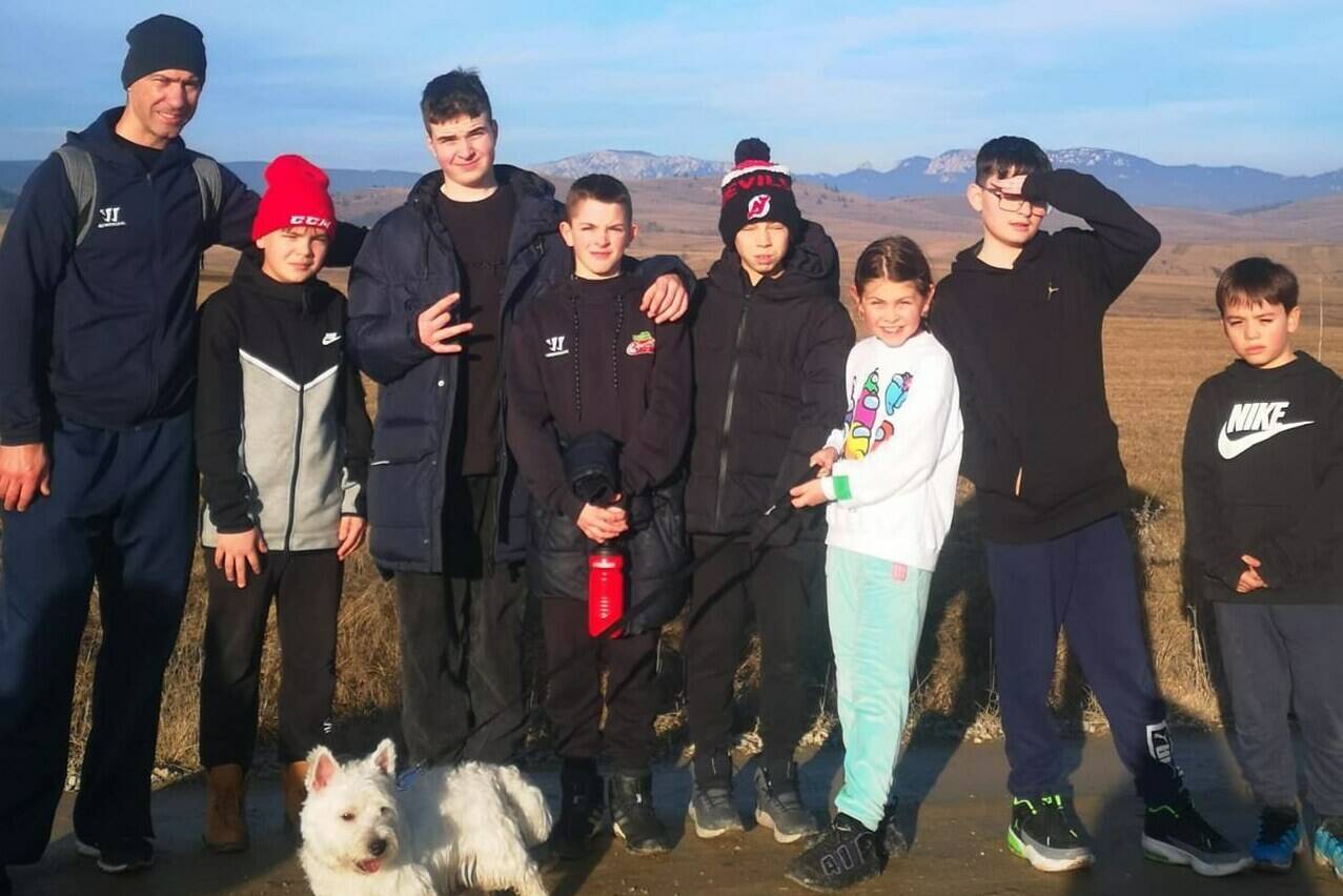 Evgheniy Pysraneko (left) is pictured with some of the young Ukrainian kids during a team bonding activity around Christmas 2022 in Romania. The 11 and 12-year-old kids who have been displaced by the war in Ukraine will travel to Canada to participate at the Quebec Peewee International Hockey Tournament next month thanks to the efforts of a Quebec City businessman. THE CANADIAN PRESS/HO- Evgheniy Pysraneko