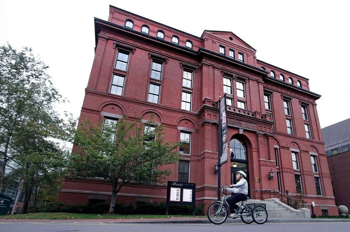 A cyclist rolls past the Peabody Museum of Archaeology & Ethnology at Harvard University in Cambridge, Mass., on October 13, 2016. After 138 years, including two decades in storage, a house post will be returned to a First Naiton in British Columbia from Harvard University. The house post was bought by a fishing company in 1885 and has been part of the museum’s anthropological artifacts since 1917. THE CANADIAN PRESS/AP, Charles Krupa