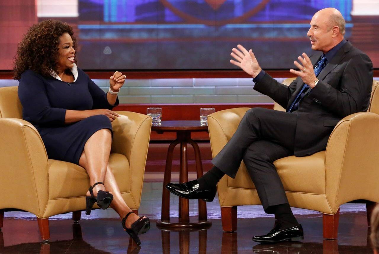 This Sept. 22, 2015 image released by CBS Media Ventures shows Oprah Winfrey, left, and Dr. Phil McGraw on the set of the “Dr. Phil.” McGraw says he’ll stop making new episodes of his daytime TV show after 21 years this spring. The Texas psychologist emerged from Oprah Winfrey’s TV tree, spinning off his frequent appearances there to start his own show in 2002. (Robert Voets/CBS Media Ventures via AP)