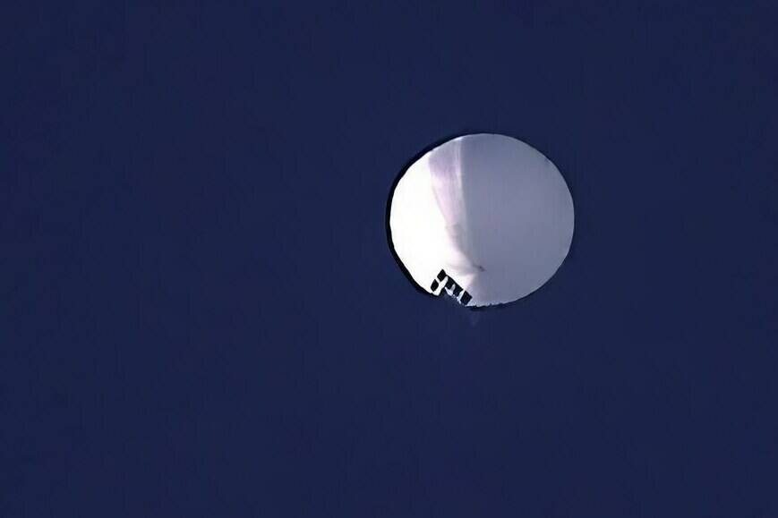 A high-altitude balloon floats over Billings, Mont., on Wednesday, Feb. 1, 2023. The Department of National Defence says Canada is working with the United States to protect sensitive information from foreign intelligence threats after a high-altitude surveillance balloon was detected. THE CANADIAN PRESS/AP, Larry Mayer/The Billings Gazette