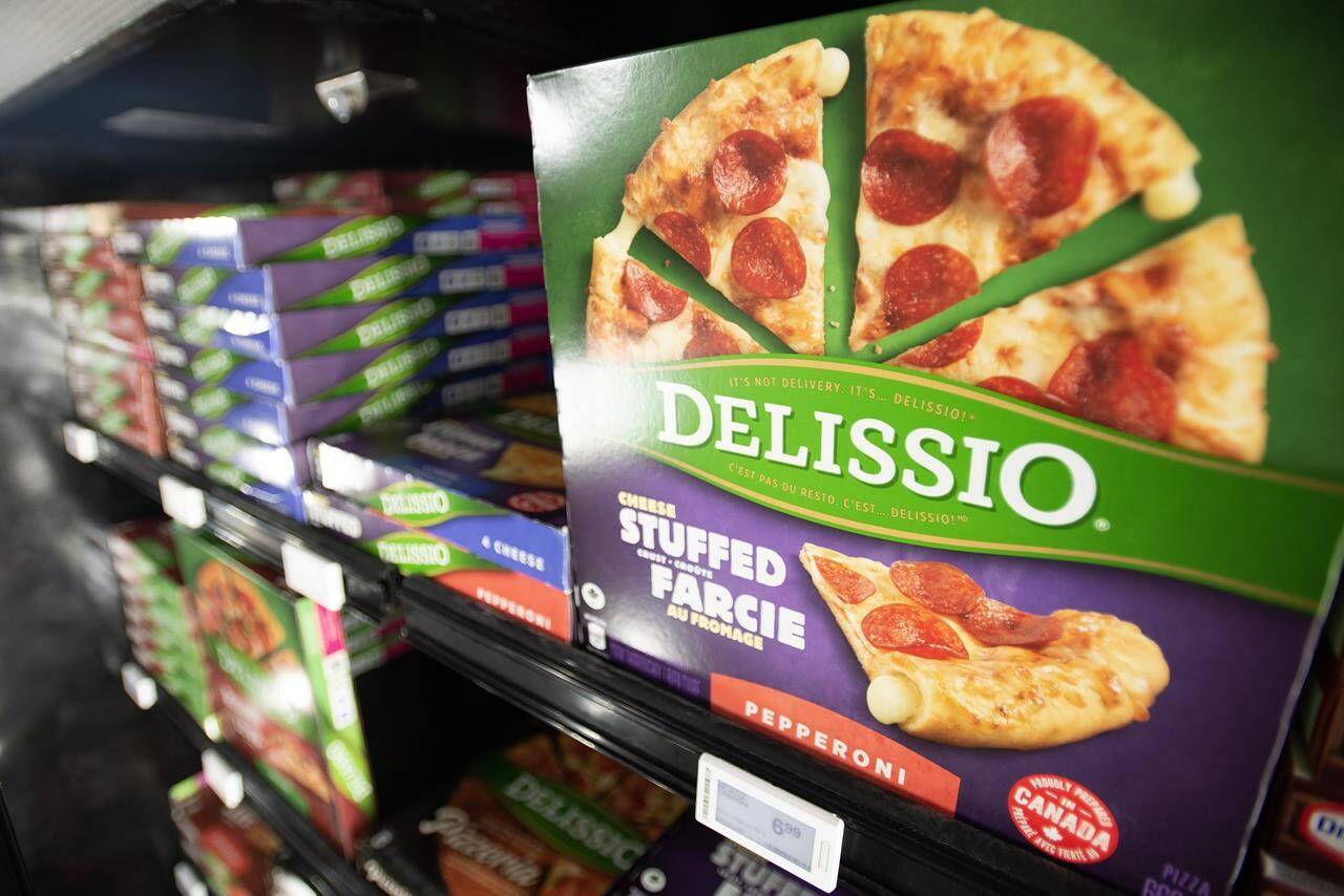 Delissio frozen pizzas are shown in the frozen food aisle at a grocery store in Toronto on Thursday, Feb. 2, 2023. Nestle Canada says it is winding down its frozen meals and pizza business in Canada over the next six months. The four brands that will no longer be sold in the freezer aisle at Canadian grocery stores are Delissio, Stouffer’s, Lean Cuisine and Life Cuisine. THE CANADIAN PRESS/Joe O’Connal