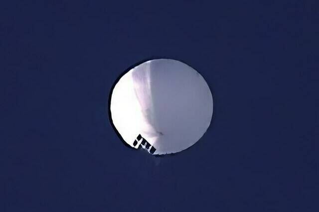 A high altitude balloon floats over Billings, Mont., on Wednesday, Feb. 1, 2023. The U.S. is tracking a suspected Chinese surveillance balloon that has been spotted over U.S. airspace for a couple days, but the Pentagon decided not to shoot it down due to risks of harm for people on the ground, officials said Thursday, Feb. 2, 2023. The Pentagon would not confirm that the balloon in the photo was the surveillance balloon. (Larry Mayer/The Billings Gazette via AP)