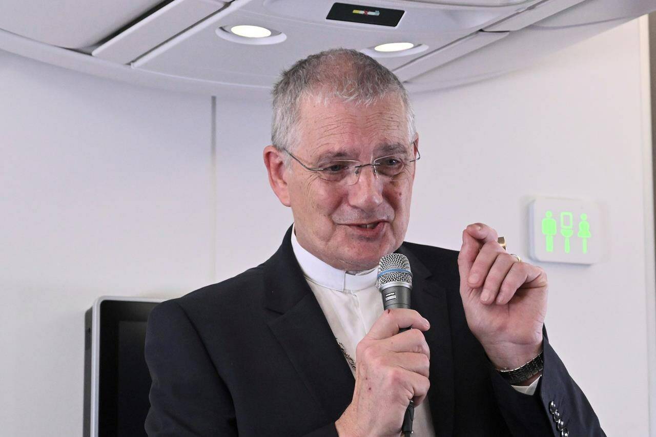 The Moderator of the General Assembly of the Church of Scotland Iain Greenshields meets the journalists during an airborne press conference aboard the airplane directed to Rome, at the end of Pope Francis pastoral visit to Congo and South Sudan, Sunday, Feb. 5, 2023. (Tiziana Fabi/Pool Photo Via AP)