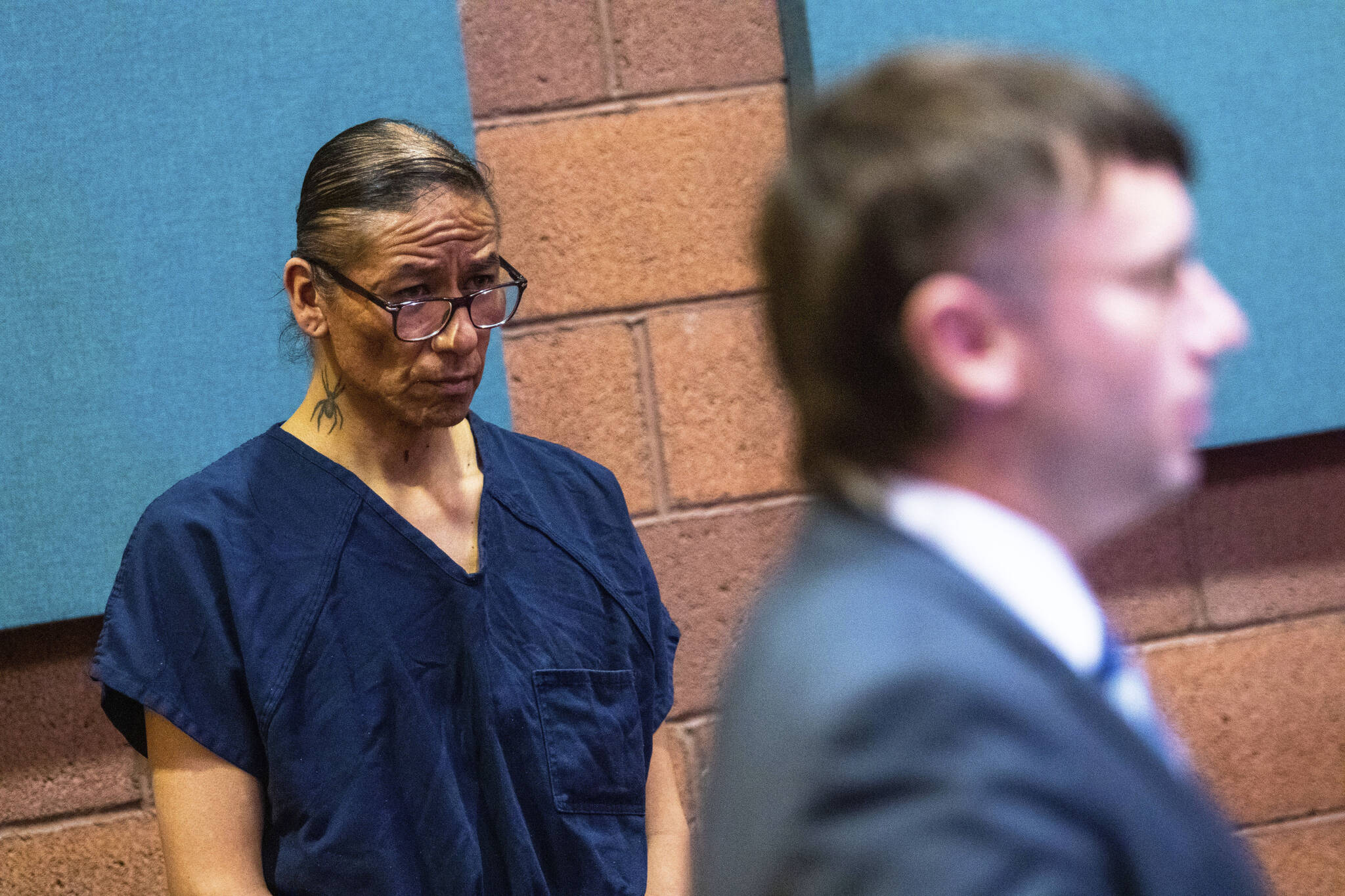 Nathan Chasing Horse listens to Chief Deputy Clark County District Attorney William Rowles speaking in court in North Las Vegas, Nev., Wednesday, Feb. 8, 2023. Bail has been set at $300,000 for the former “Dances With Wolves” actor charged in Nevada with sexually abusing and trafficking Indigenous women and girls. (AP Photo/Ty O’Neil)