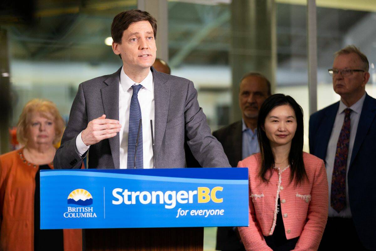 Premier David Eby, Minister of Municipal Affairs, Anne Kang, and mayor Brenda Locke at an announcement for local government infrastructure in Surrey on Friday, Feb. 10, 2023. (Photo: Anna Burns)