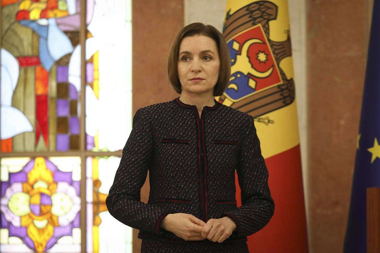 Moldovan President Maia Sandu pauses as Prime Minister designate Dorin Recean speaks after she appointed him to form a new government in Chisinau, Moldova, Friday, Feb 10, 2023. Moldova’s government collapsed Friday as pro-Western Prime Minister Natalia Gavrilita resigned, adding to a series of crises that have gripped the small nation since Russia invaded its neighbor, Ukraine. (AP Photo/Aurel Obreja)