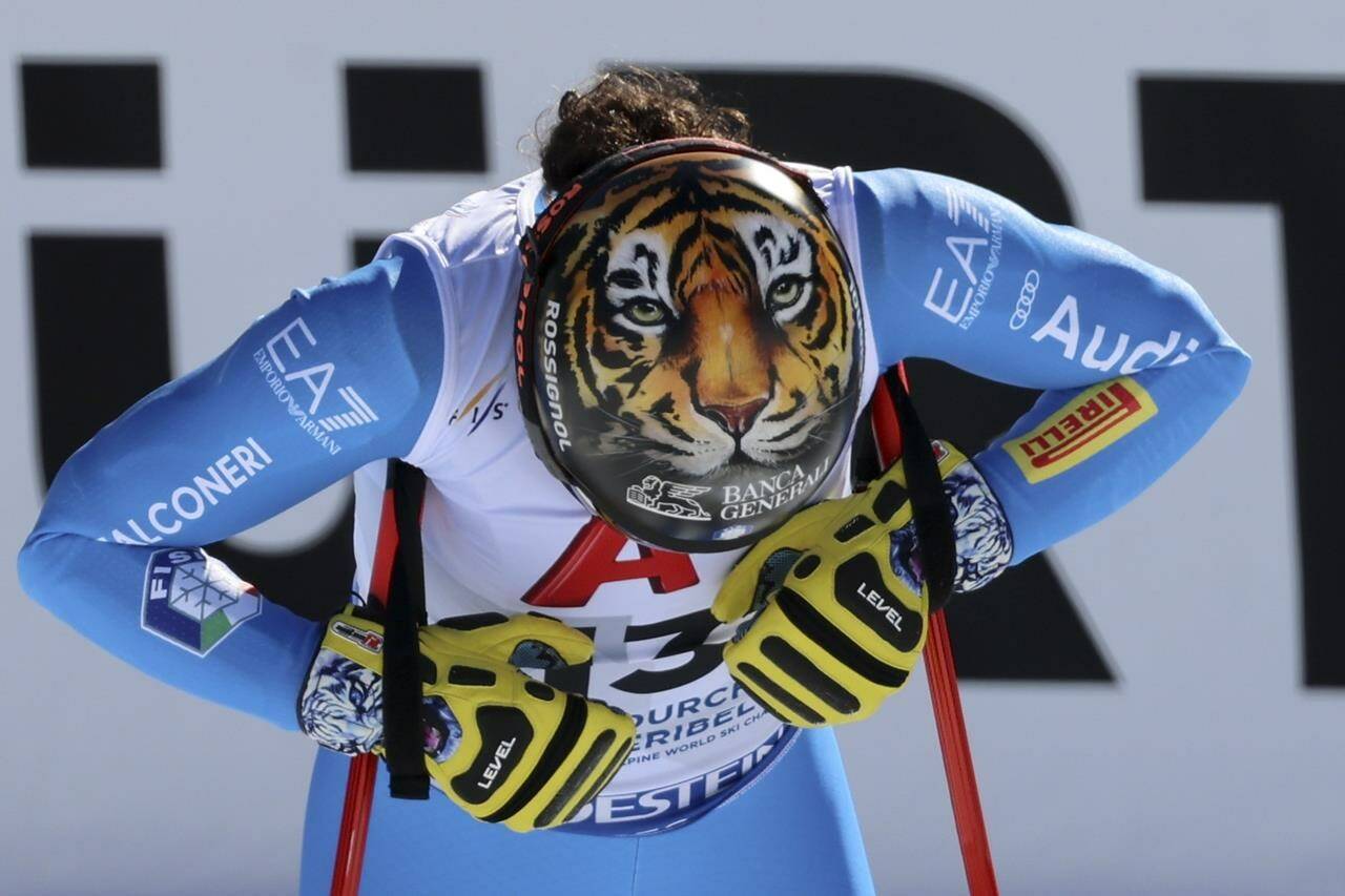 A tiger is depicted on the helmet of Italy’s Federica Brignone at the finish area of an alpine ski, women’s World Championships super G, in Meribel, France, Wednesday, Feb. 8, 2023. (AP Photo/Marco Trovati)