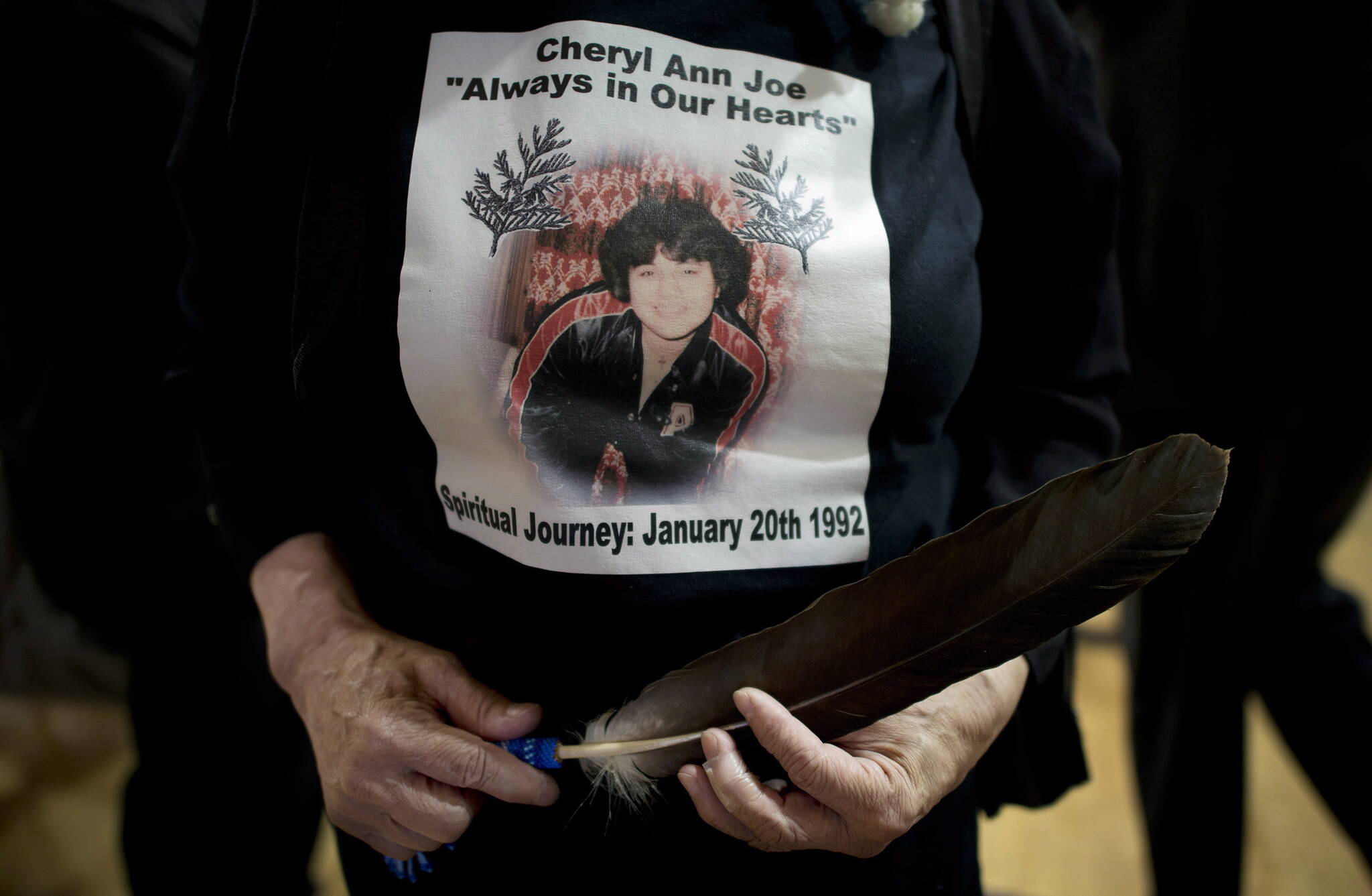 Gertrude Pierre wears a shirt in memory of her niece Cheryl Ann Joe during a signing of a memorandum of understanding in North Vancouver, B.C., Friday, June 13, 2014. Joe, who was murdered in Jan. 1992, was remembered as First Nations groups pledged to end violence against aboriginal women and girls. THE CANADIAN PRESS/Jonathan Hayward