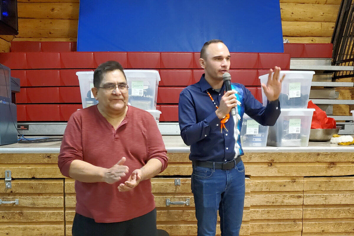 Hereditary Chief Yulm Snuxyaltwa (Deric Snow) of the Nuxalk Nation, left, and Williams Lake First Nation Chief Willie Sellars thank the cooks for preparing the food for an honouring ceremony held Wednesday, Feb. 15 at Sugar Cane for the convoy transporting a repatriated totem pole back to the Bella Coola area. (Monica Lamb-Yorski photo - Williams Lake Tribune)