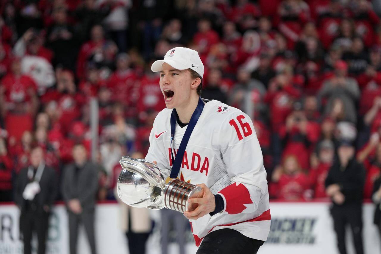 Canada’s Connor Bedard carries the IIHF Championship Cup while celebrating winning over Czechia at the IIHF World Junior Hockey Championship gold medal game in Halifax on Thursday, January 5, 2023. Connor Bedard keeps packing arenas in Western Canada after his electrifying performance at the world junior men’s hockey championship. THE CANADIAN PRESS/Darren Calabrese
Canada’s Connor Bedard carries the IIHF Championship Cup while celebrating winning over Czechia at the IIHF World Junior Hockey Championship gold medal game in Halifax on Thursday, January 5, 2023. Connor Bedard keeps packing arenas in Western Canada after his electrifying performance at the world junior men’s hockey championship. THE CANADIAN PRESS/Darren Calabrese