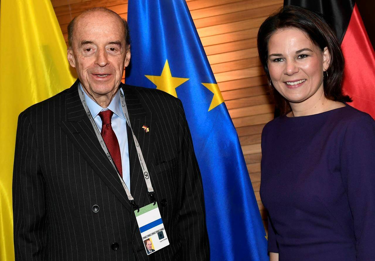 German Foreign Minister Annalena Baerbock, right, and Colombia’s Foreign Minister Alvaro Leyva Duran, left, pose during a bilateral meeting on the sidelines of the Munich Security Conference in Munich, Germany, Friday, Feb. 17, 2023. (Thomas Kienzle/Pool Photo via AP)