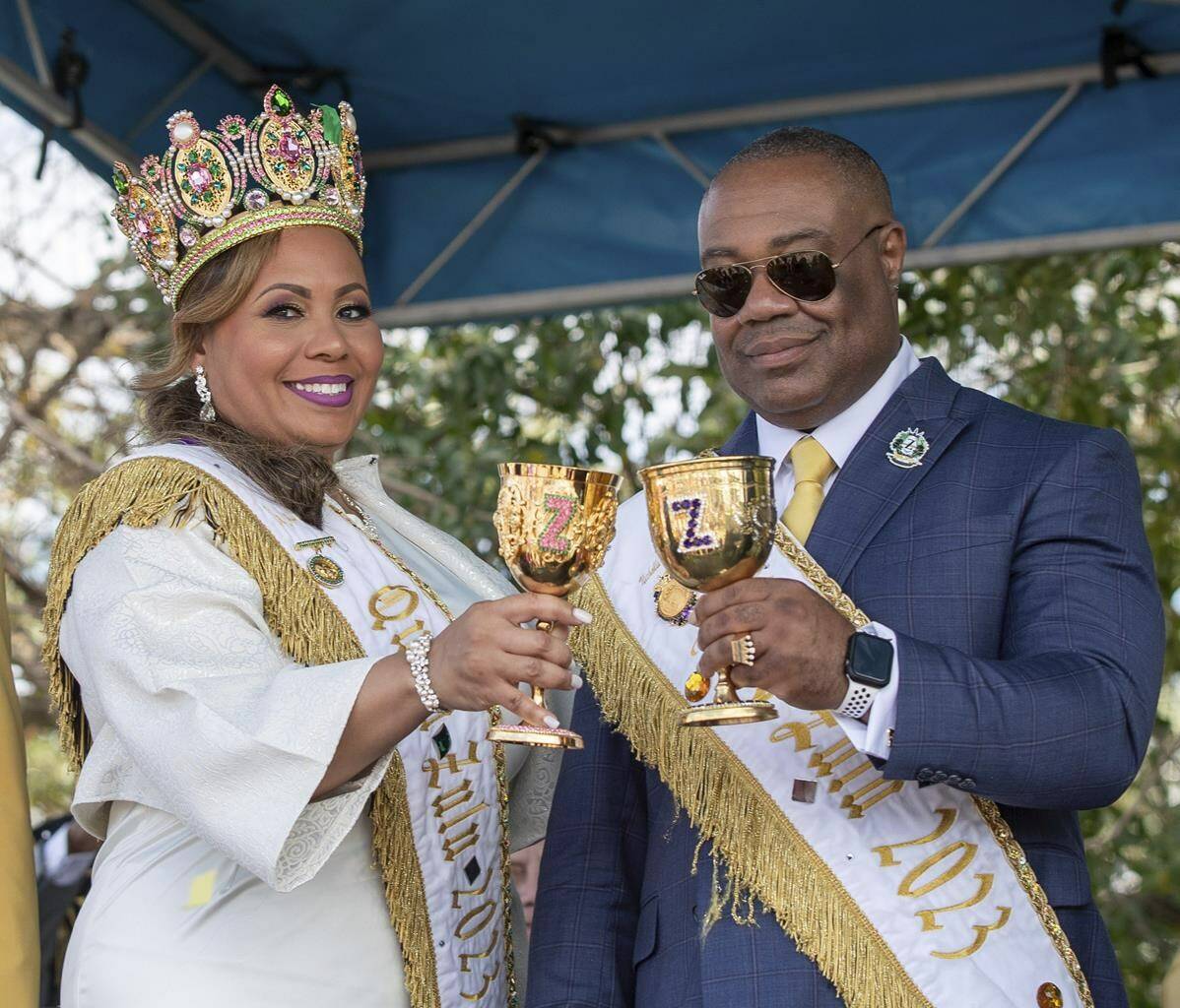 Zulu king and queen couple, Nicholls “Nick” Spears Sr. and Christy Lagarde Spears toast during the annual meeting of the courts ceremony on Lundi Gras in Kenner, La., Monday, Feb. 20, 2023. (David Grunfeld/The Times-Picayune/The New Orleans Advocate via AP)