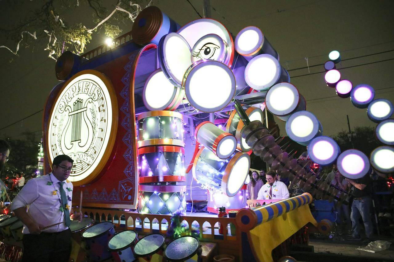 The Krewe of Orpheus rolls through New Orleans the night before Mardi Gras, known as Lundi Gras, Monday, Feb. 20, 2023. (AP Photo/Dorthy Ray)