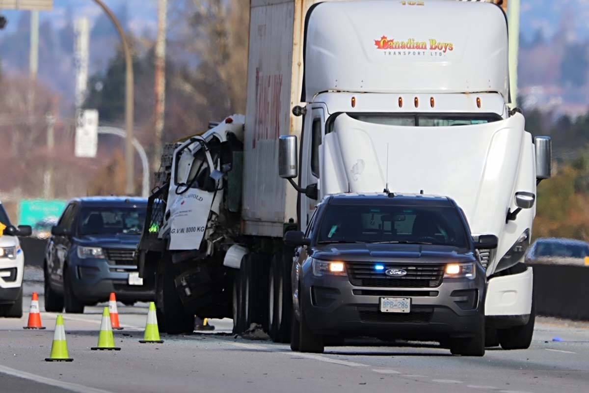 One driver died Tuesday (Feb. 21) following a crash between a flat-bed truck and semi-trailer on Highway 99 in Richmond. (Shane MacKichan/Special to Black Press Media)