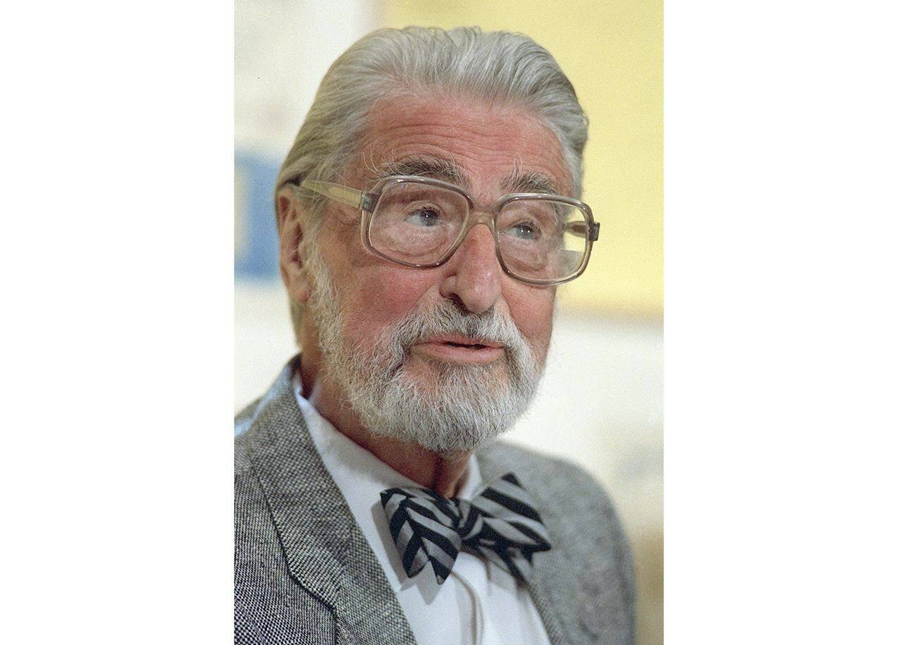 FILE — American author, artist and publisher Theodor Seuss Geisel, also known by his pen name Dr. Seuss, appears at an event in Dallas, April 3, 1987. Seuss Enterprises, the company that owns the Dr. Seuss intellectual property, is releasing a sequel to the iconic children’s book “How the Grinch Stole Christmas!” The new book is to be called “How the Grinch Lost Christmas!” (AP Photo/File)