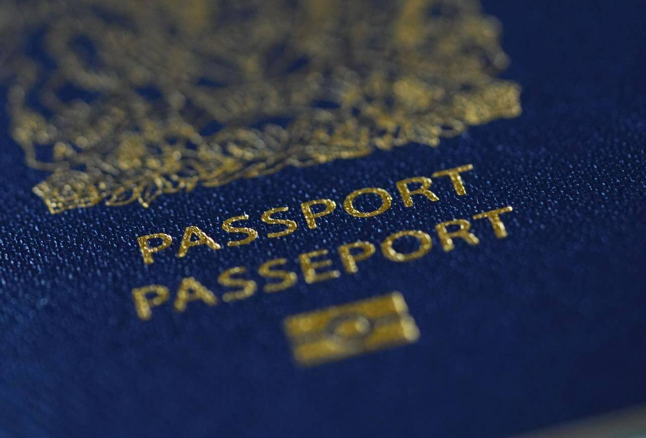 A Canadian passport is pictured in Ottawa on Tuesday, Jan. 17, 2023. As of March 1, measures will come into effect to simplify the process for Iranians visiting, studying or working in Canada to extend their stay and switch between temporary streams. THE CANADIAN PRESS/Sean Kilpatrick