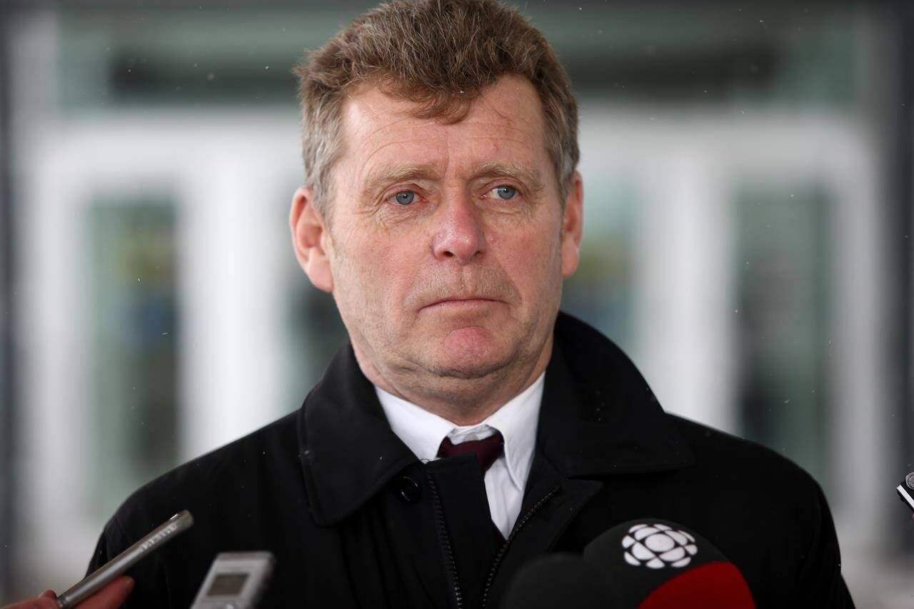Ian Moss, CEO of Gymnastics Canada speaks with reporters outside the courthouse in Sarnia, Ont. on Wednesday, Feb. 13, 2019. Moss is out as chief executive officer of Gymnastics Canada, a move that comes amid calls for leadership change at the embattled sports organization. THE CANADIAN PRESS/Mark Spowart